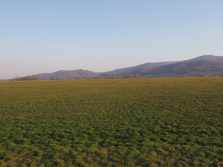 View to Silesian Beskid Mountains range in european Bielsko-Biala city at Silesian district in Poland, clear blue sky in 2020 warm sunny spring day on April.