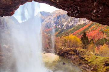 Waterfall in an autumn day in the italian alps