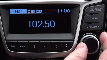 male hand change search the radio wave station FM car digital radio blue screen