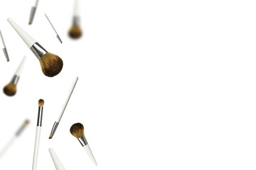 Creative composition with Eco friendly make up brushes levitating on white background with copy space for your design. Beauty salon banner mock up, selective focus.