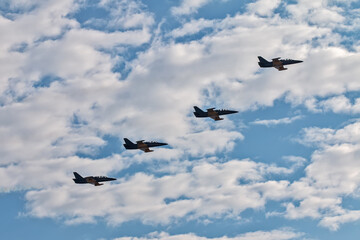Four planes against the sky. Aerobatics