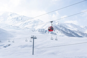 Fototapeta na wymiar ski lift in the snow mountains