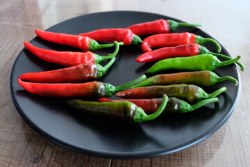 Life cycle of peppers. Stages of red hot pepper growth from green to red. Hot ripen chili peppers without GMO. Nature. Organic Mexican or Turkish spices. It is called 