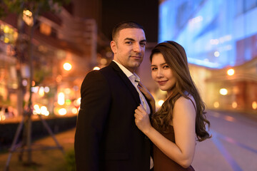 Portrait of couple outdoors at night in the city at Bangkok Thailand
