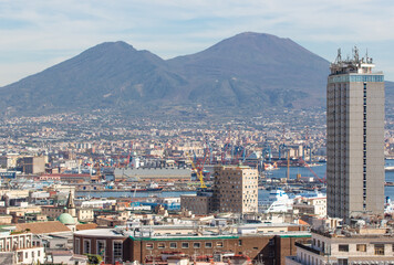 Naklejka premium Naples, Italy - a Unesco World Heritage old town, Naples displays also a modern business center, here dominated by Mount Vesuvius on the background 