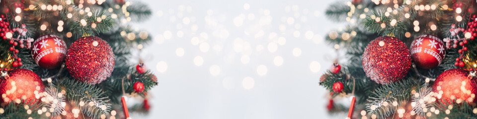 Closeup of Decorated Christmas tree on blurred, sparkling and fairy light background. Happy...