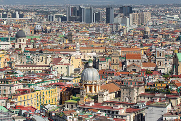Fototapeta premium Naples, Italy - a Unesco World Heritage old town, Naples displays also a modern business center, here dominated by Mount Vesuvius on the background 