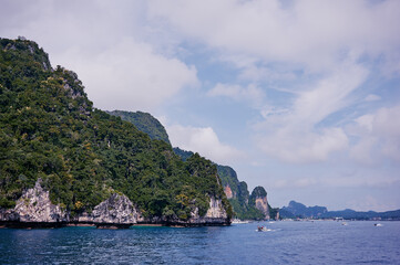 Vacation in Thailand. Phi Phi Don Island. Beautiful landscape with sea, boat and rocks.