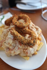 rings of squid and ship on plate