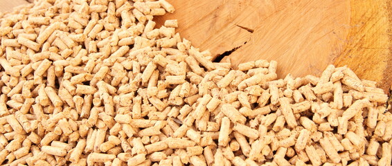 a slice of cherry wood surrounded by wood pellets