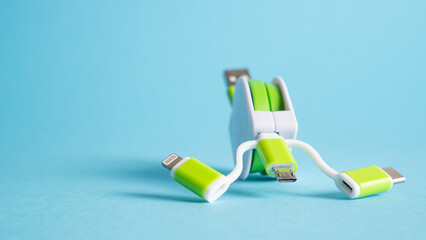 Universal multi charger device for mobile. Compact phone charger. Green USB adapter. Type C, mini USB and micro USB