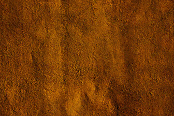 Copper colored wall texture background with textures of different shades of copper or bronze