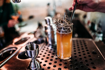 unique cocktail on the bar with a straw