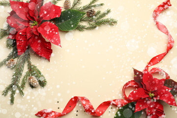 Flat lay composition with traditional Christmas poinsettia flowers and space for text on beige background. Snowfall effect