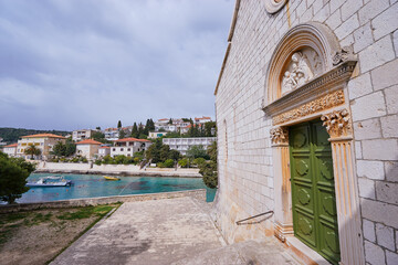 Obraz premium The Franciscan Monastery on Hvar Old Town Sea Promenade in Croatia.