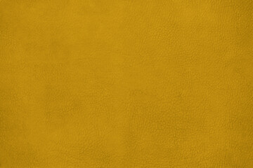 Leather texture background surface. Close-up, toned in Fortuna Gold, colour 2021.