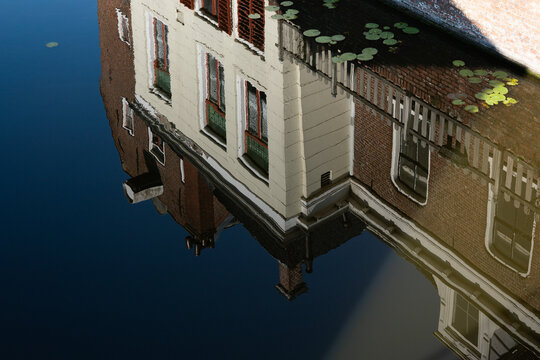 reflection of hoses in canal Appingedam, The Netherlands