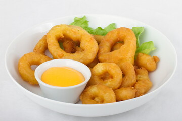 Tempura squid rings with cheese sauce