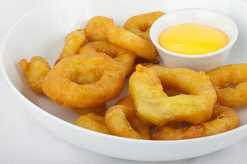 Tempura squid rings with cheese sauce