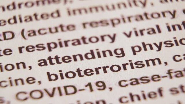 Macro shot of the word "bioterrorism" highlighted with a yellow marker. The concept health and safety
