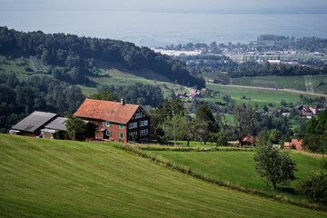Fototapeta na wymiar Alpine mountains landscape. Traditional farm house with wonderfull view.