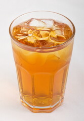 Fototapeta na wymiar Apple juice with ice cubes in a glass Cup