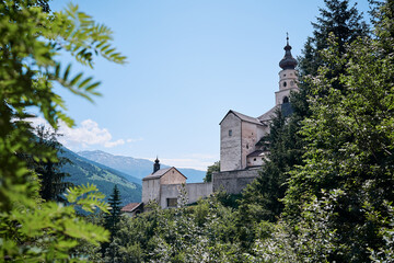 Beautiful summer landscape with ancient monastery in mountains. Benedictine Abbey of Monte Maria in...