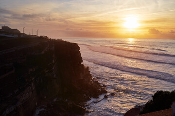 Fototapeta premium Beautiful landscape with colorful sunset on the Atlantic ocean rock shore, Portugal.