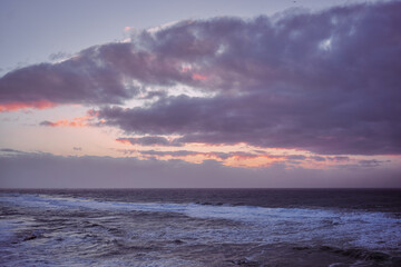 Amazing sunset on Atlantic ocean. Waves and foam.