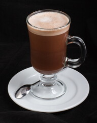 Hot chocolate in a clear glass glass