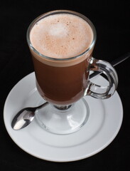 Hot chocolate in a clear glass glass