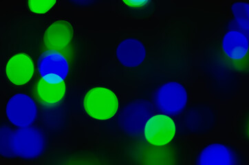 Abstract pattern of colorful bokeh lights on dark background