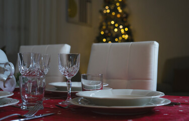 Close up shot of wine glasses at Christmas dinner table