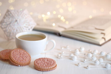 Obraz na płótnie Canvas Cocoa, book, white umbrella, cookies and marshmallows.