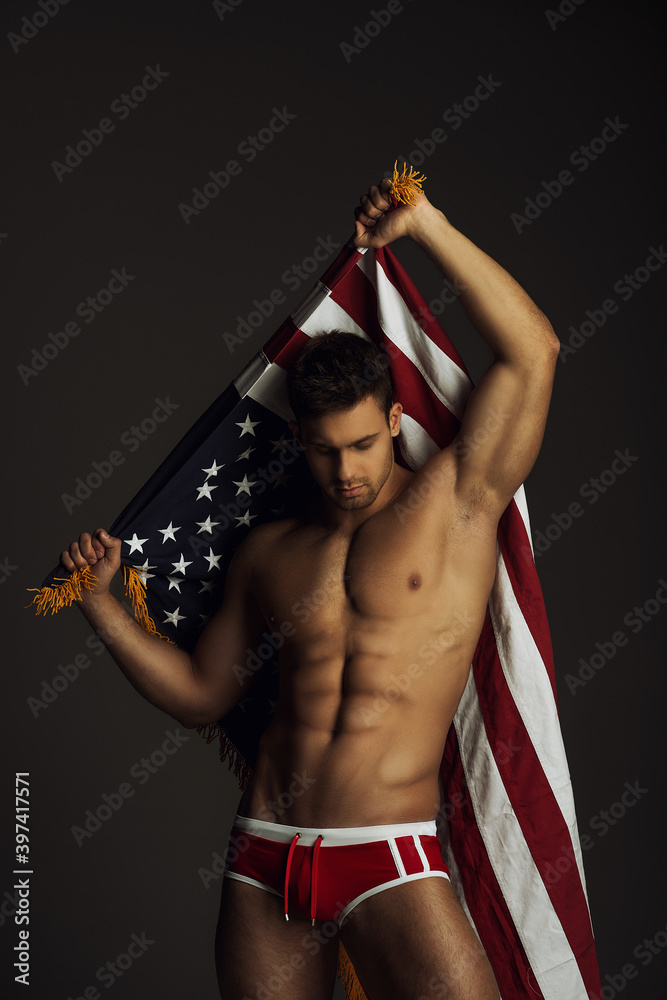 Wall mural fitness man in red underwear with american flag