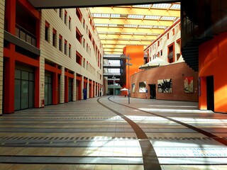 Asti, Italy - December 03, 2020: An amazing construction of a modern hospital by only wood and other organic materials, grey glasses and some handmade paints over the wall.
