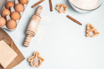Shortcrust pastry for gingerbread.Christmas background for baking, top down view, copy space. Christmas and New Years, family celebration traditions. cinnamon, spices, flour on a white table.