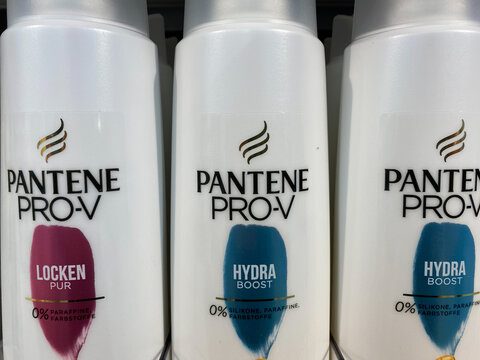 Viersen, Germany - May 9. 2020: Closeup of bottles Pantene Pro-V shampoo in shelf of german supermarket