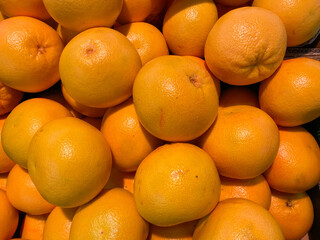 Close up of isolated group ripe raw yellow grapefruits on german market