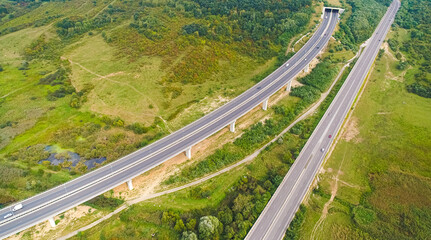 Aerial view of A1 Transylvania Highway between Sibiu and Sebes with spectacular viaduct bridge and passage route, roads of Romania