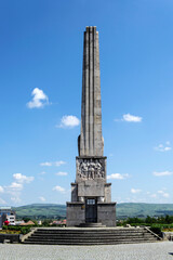Fototapeta na wymiar The obelisk of Horea, Closca and Crisan located in front of the third gate of the Alba Carolina fortress. Alba Iulia, Romania.