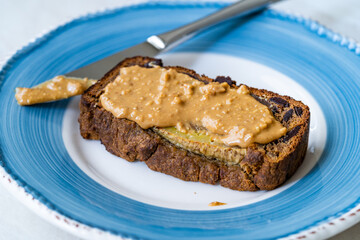 Banana Bread Slice with Creamy Peanut Butter Cream Paste.