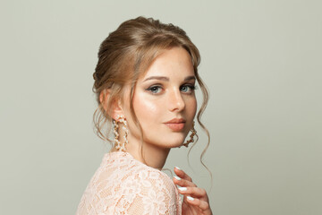 Adorable woman with natural freckles skin and ginger hair on white background