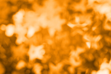 Abstract blurred orange glitter background. Bright and colorful background.