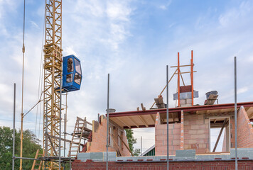 Fototapeta na wymiar Building site with crane and new building
