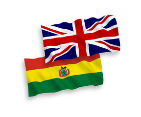 National vector fabric wave flags of Great Britain and Bolivia isolated on white background. 1 to 2 proportion.