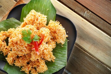 Thai dessert crispy noodles(Mee Krob) In a four-shaped plate  