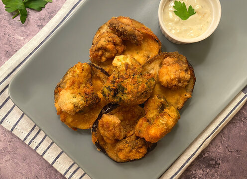 Vegetarian Breaded Vegetables In Breadcrumbs. Zucchini And Mushroom With Sauce Tartare.