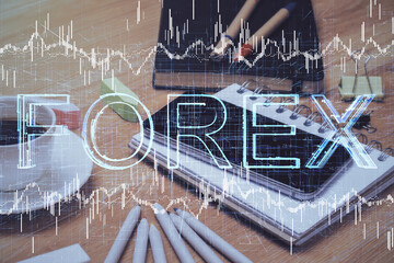 Double exposure of forex chart drawing and cell phone background. Concept of financial trading