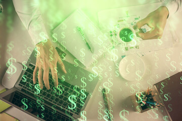 Multi exposure of man's hands typing over computer keyboard and forex graph hologram drawing. Top view. Financial markets concept.